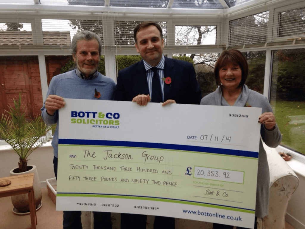 Flight Delay Lawyer Kevin Clarke presents the Jackson group’s cheque to Mr and Mrs Jackson